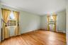 Bedroom #2 features hardwood floors and double windows