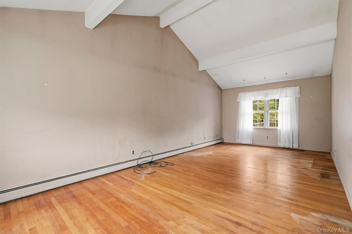 The living room is the full width of the home.
