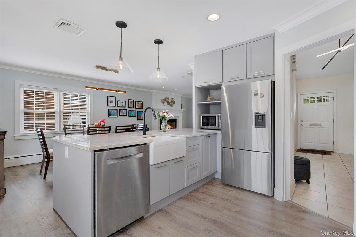 Contemporary kitchen with island and farmhouse sink.