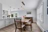 Dining area with view of kitchen.