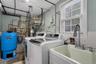 Laundry room with utility sink and washer/dryer.