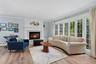 Bright living room with bay window.