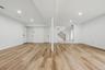 Lower level with brand new floors & fresh paint.