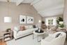 This living room can accommodate numerous seating areas. Virtually staged