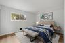 Virtually staged 2nd bedroom with brand new floors.