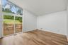 Primary bedroom with brand new floors, en-suite bathroom, & walk-in closet.