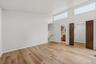 Primary bedroom with brand new floors, en-suite bathroom, & walk-in closet.