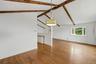 Dining area w/ hardwood floors and fresh paint.