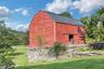 Totally renovated  original  barn with party room,  full kitchen, full bath, two bedroom apartment and 3 car garage.