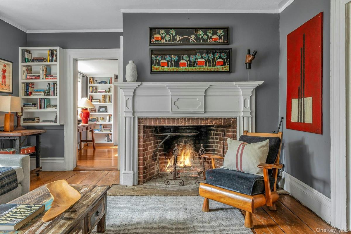 Welcoming and easy transitions connecting every room. Original fireplaces w/intricate detailing