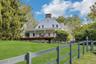 Circa 1795 Dutch Colonial  Farmhouse  on a country road w/farms on  either side.