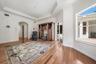 Engineered Hardwood flooring, crown molding, tray ceiling - slider access out to pool area