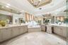 Extensive vanity with dual sinks, built-in makeup area, and integrated storage