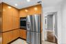 Recessed lighting, stainless steel appliances, built-in oven, full-height cabinetry