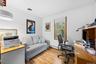 Bedroom or versatile home office featuring hardwood flooring, recessed ceiling lighting, and ample natural light