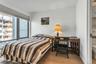 Bedroom featuring light wood-type flooring and baseboards