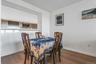 Dining space featuring dark wood-style floors