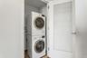 Washroom featuring estacked washer and dryer