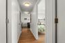 Hall with wood finished floors and baseboards