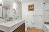 Bathroom with vanity and tiled shower / bath combo