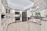 Furniture-grade cabinetry, granite countertops, stainless steel appliances, and loads of under cabinet lighting