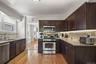 Updated kitchen with stainless steel appliances and plenty of space for cooking and storage.
