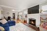 Open family and dining room with wood-burning fireplace