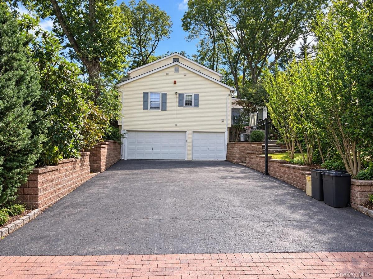 Additional driveway with 3 car garage