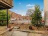 View of yard featuring fence and a residential view
