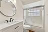 Beautifully renovated with an elegant, timeless design, the second-floor guest bathroom conveniently serves both guest bedrooms and the versatile loft