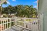 The primary suite’s private balcony offers a peaceful place to begin the day with morning coffee while enjoying views of the backyard and Fairfield’s 