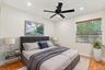 Both upstairs guest bedrooms are generously sized and filled with natural light, offering ample closet space and comfortable accommodations for family