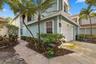 Before you step inside, you are welcomed by the charm of Fairfield, a gated community in Central Boca Raton featuring mature oak trees and an impressi