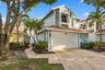 Located in a gated community in the heart of Boca Raton, this beautifully updated three bedroom, two and a half bathroom home with a loft is truly mov