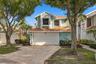 Located in a gated community in the heart of Boca Raton, this beautifully updated three bedroom, two and a half bathroom home with a loft is truly mov