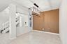 The open-concept floor plan seamlessly connects the living room and elegant formal dining area, creating an inviting setting for memorable dinners and