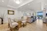 Light-filled living and dining area extending naturally to the lanai.