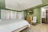 Primary bedroom with elegant details and a bright, airy feel.