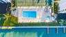 Heated pool & spa overlooks the crystal clear waters