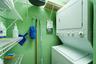 Private utility room with convenient washer and dryer and separate water heater.