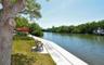 Five plus acres of lush tropical grounds, surrounded by water on 3 sides.