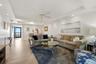 Open living and dining area with a seamless flow to the balcony and  lanai.