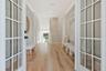 Welcoming French doors on floors one and two