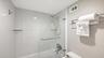 Primary bathroom, shower/tub with glass door