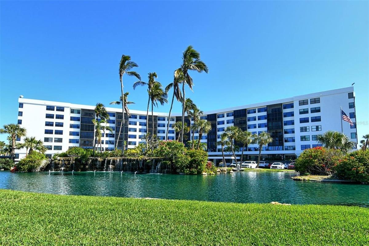 Front of building, unit overlooks this lake.