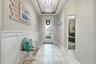 Elevated design details continue down the main hallway, leading naturally into the main living areas