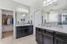 Primary bath with double vanity and granite counters