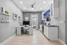 Flex room with built-in shelving and Alexa-compatible lighting, set up as a home office