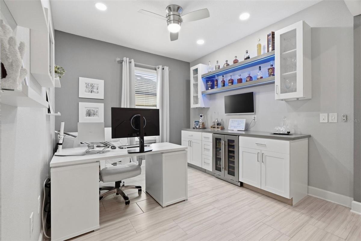 Flex room separate from bedrooms, featuring built-in shelving.