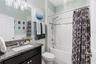 Secondary full bath with granite counters and tub/shower combo
